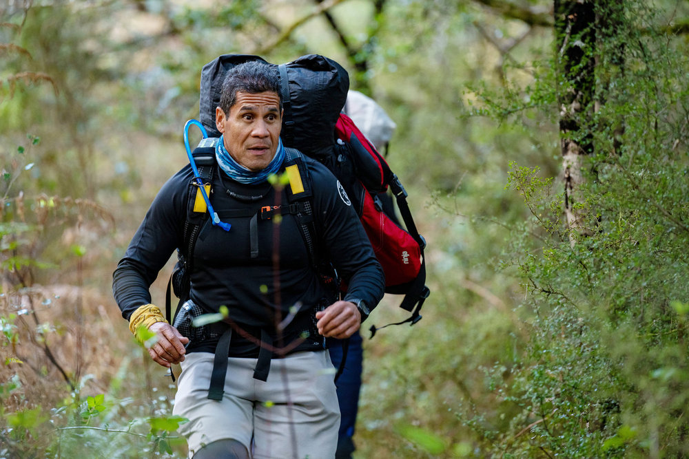 Emilio Navarro running through the forest on Race to Survive: New Zealand 