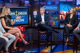 Andy Cohen sitting in between Captain Sandy Yawn and Hannah Ferrier during a Below Deck Med reunion