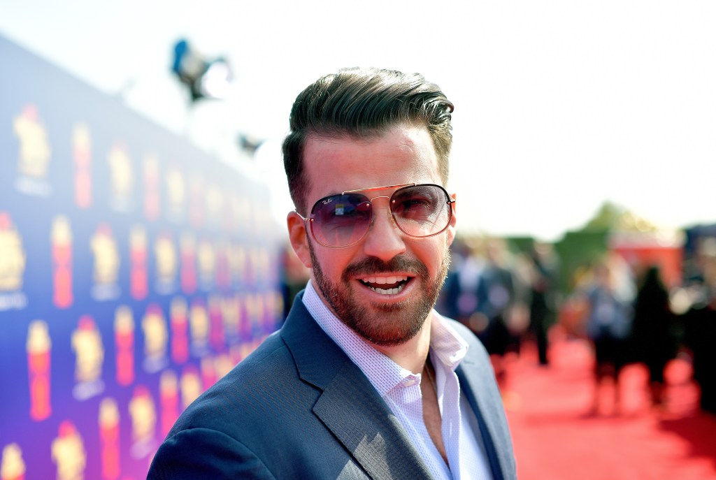 Johnny Bananas smiling on the red carpet at the 2019 MTV Movie and TV Awards - he is returning for The Challenge Season 40