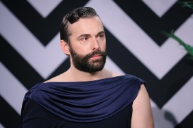 Jonathan Van Ness in a blue dress making a stern face