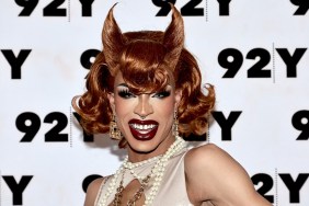 Yvie Oddly in an off-white dress wearing a horn-shaped wig