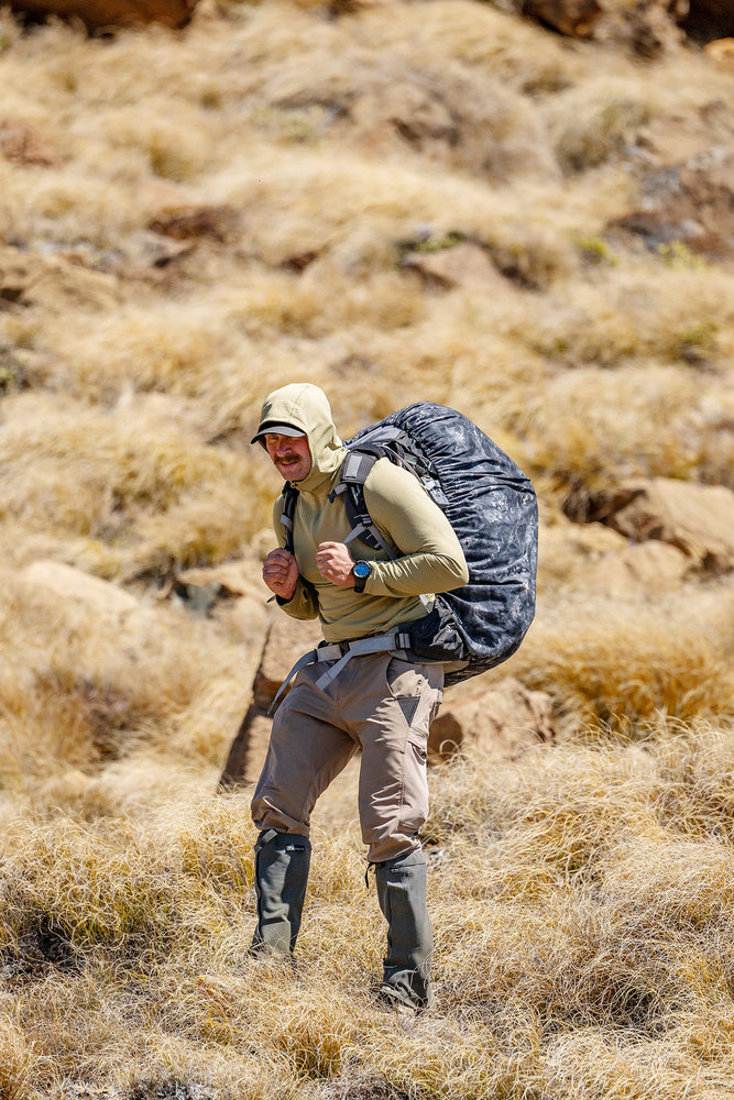 Ryan Stewart walking down a hill on Race to Survive: New Zealand