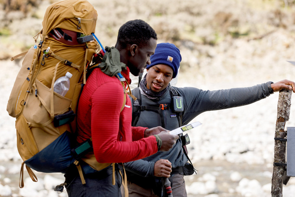 Mikhail and Steffen navigating and looking at a map on Race to Survive: New Zealand