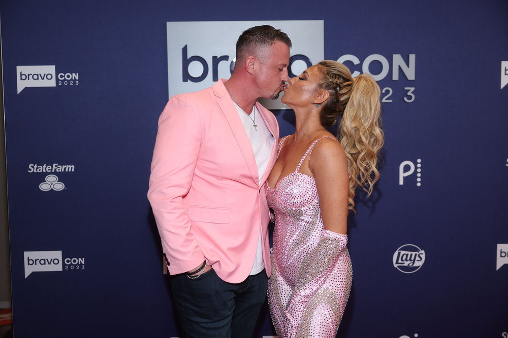 Danielle and Nate Cabral kissing at BravoCon 2023.