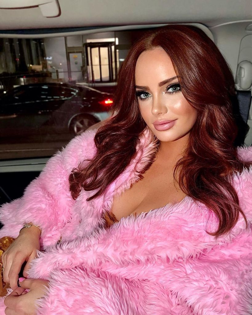 Kathryn Dennis in a pink fur coat sitting inside of a car