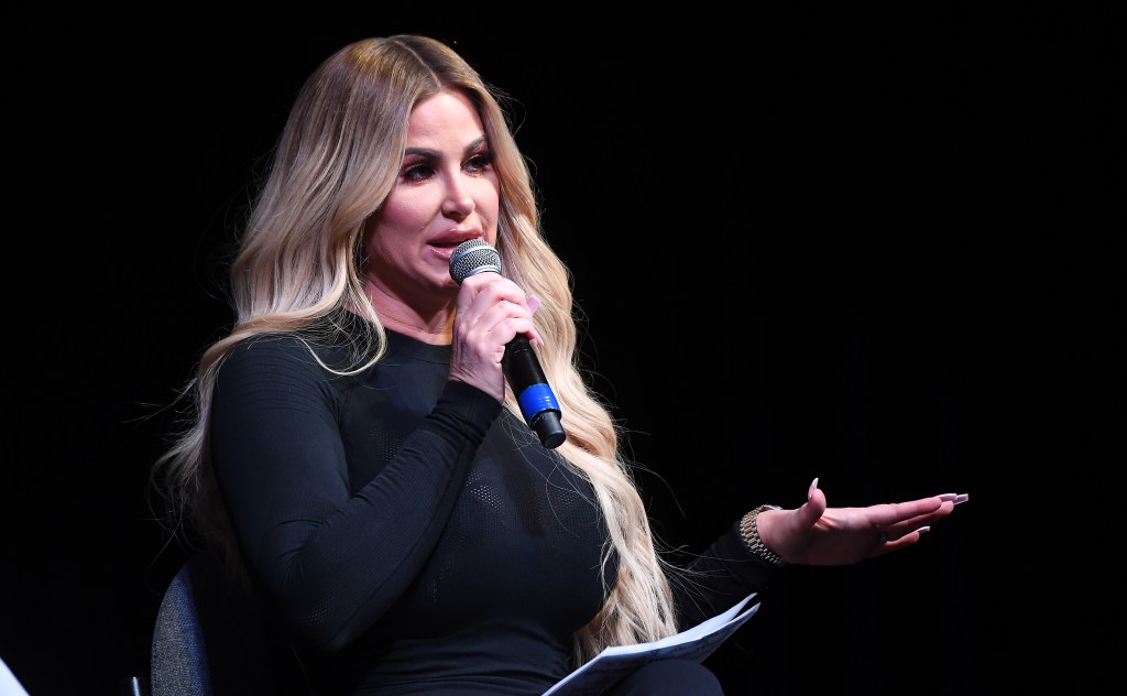 Kim Zolciak talking into a microphone