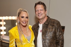 Shannon Beador posing in a yellow suit with John Janssen, the latter of which is now suing Shannon for fraud
