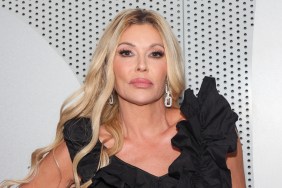 Brandi Glanville in a black dress at a clinic opening.