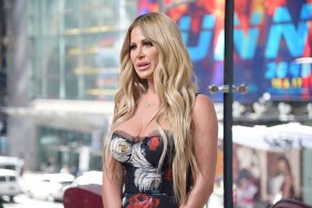 Kim Zolciak standing with a blank expression on her face