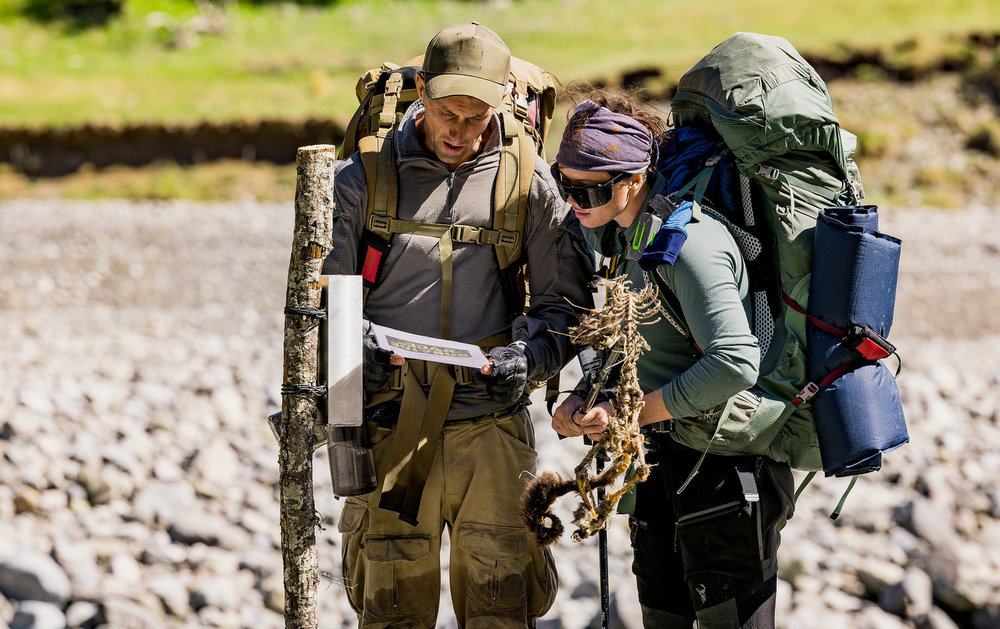 Nikola Milutinovic, Kennedy Taylor looking at a map on Race to Survive: New Zealand