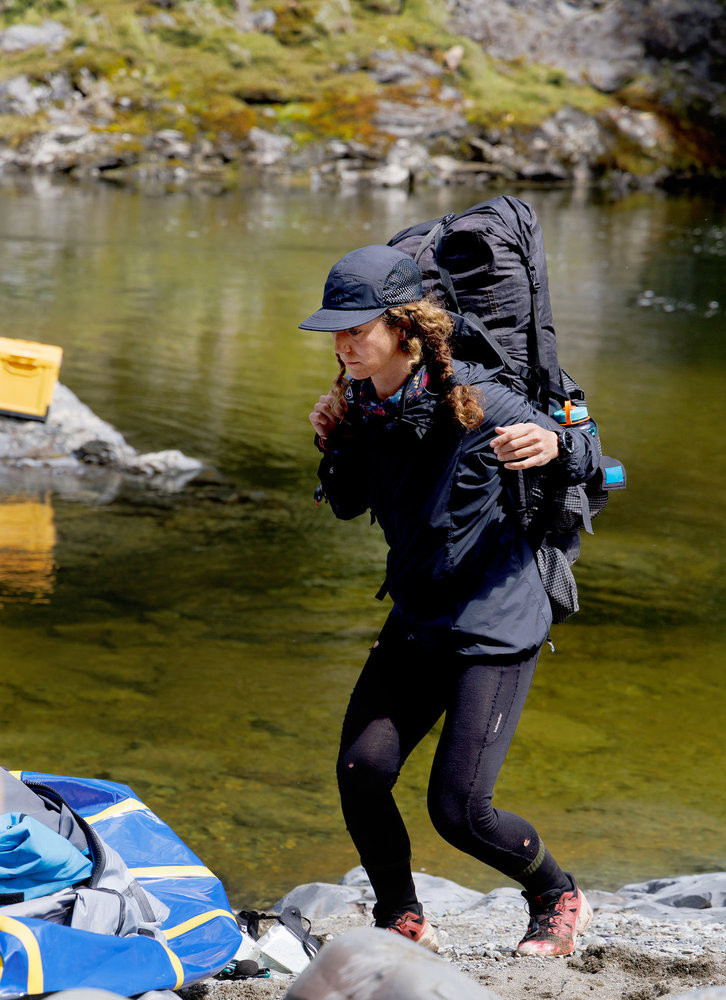 Paulina Pena running with a backpack on Race to Survive: New Zealand