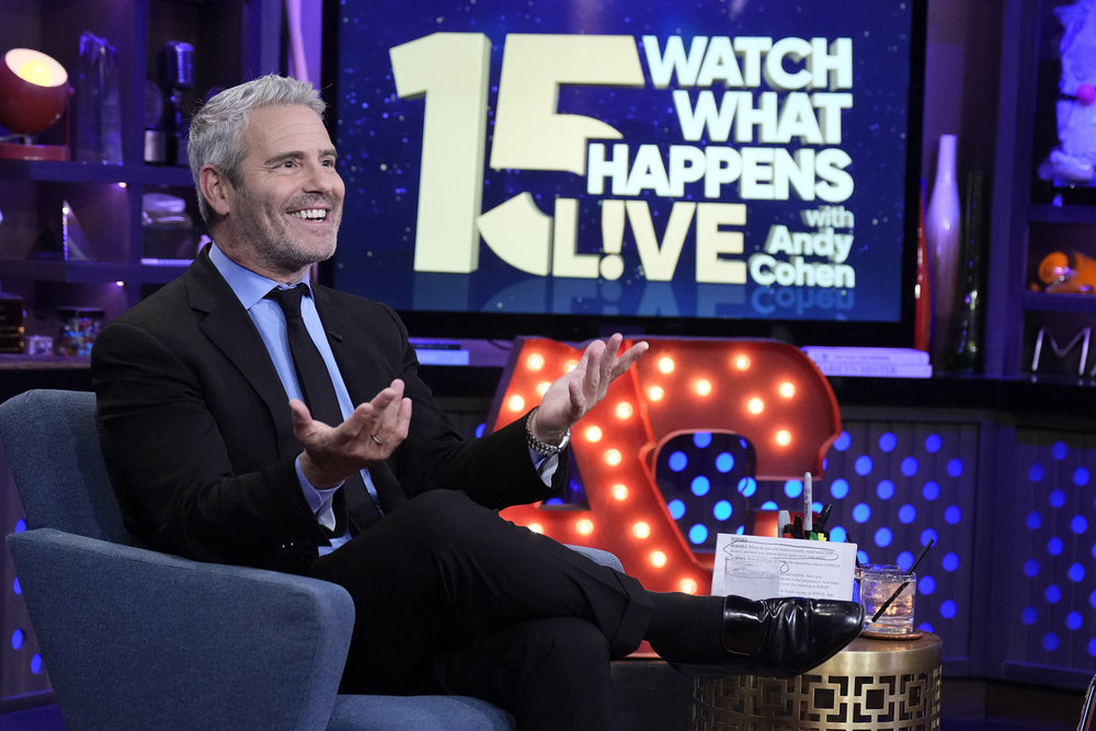 Andy Cohen smiling on the set of Watch What Happens Live 15th anniversary special 