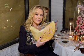 Kathy Hilton holding up a yellow purse