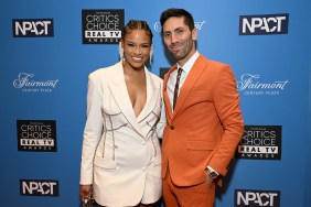 Catfish hosts Nev Schulman and Kamie Crawford posing together at a red carpet