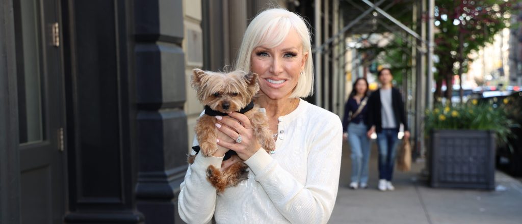 Margaret Josephs holding a little doggie