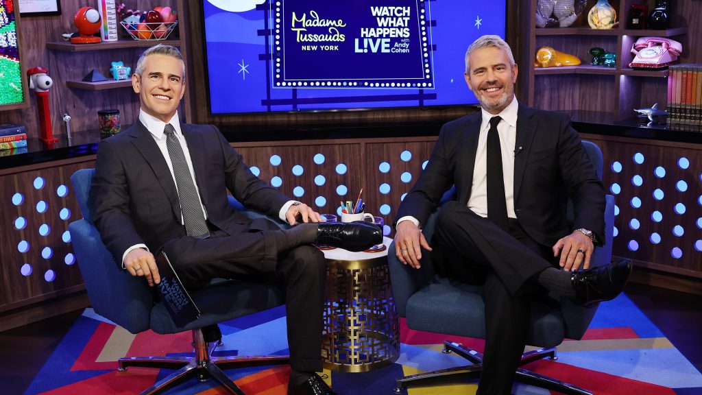 WWHL host Andy Cohen next to his new wax figure.