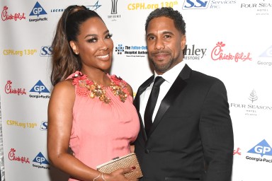 Kenya Moore and Marc Daly posing together in 2018