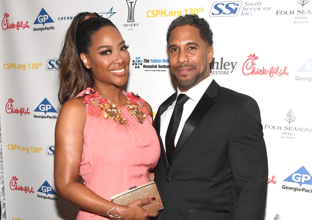 Kenya Moore and Marc Daly posing together in 2018