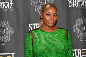 NeNe Leakes posing in a sparkly green dress