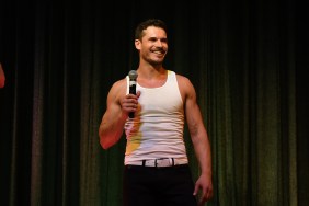 Gleb Savchenko holding a mic on stage at Chippendales looking fabulous.