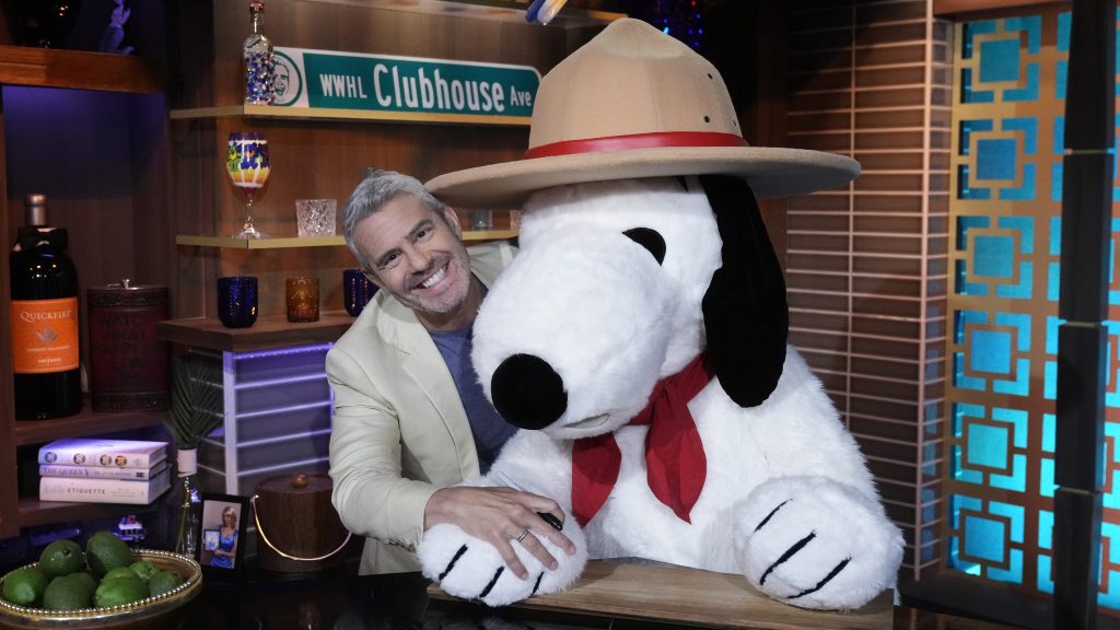 Andy Cohen loving up on Snoopy - but not for dinner.