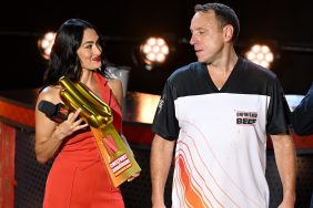 Nikki Garcia with Joey Chestnut at a hotdog eating competition.