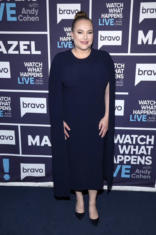 Meghan McCain wearing a navy blue cloak backstage at Watch What Happens Live