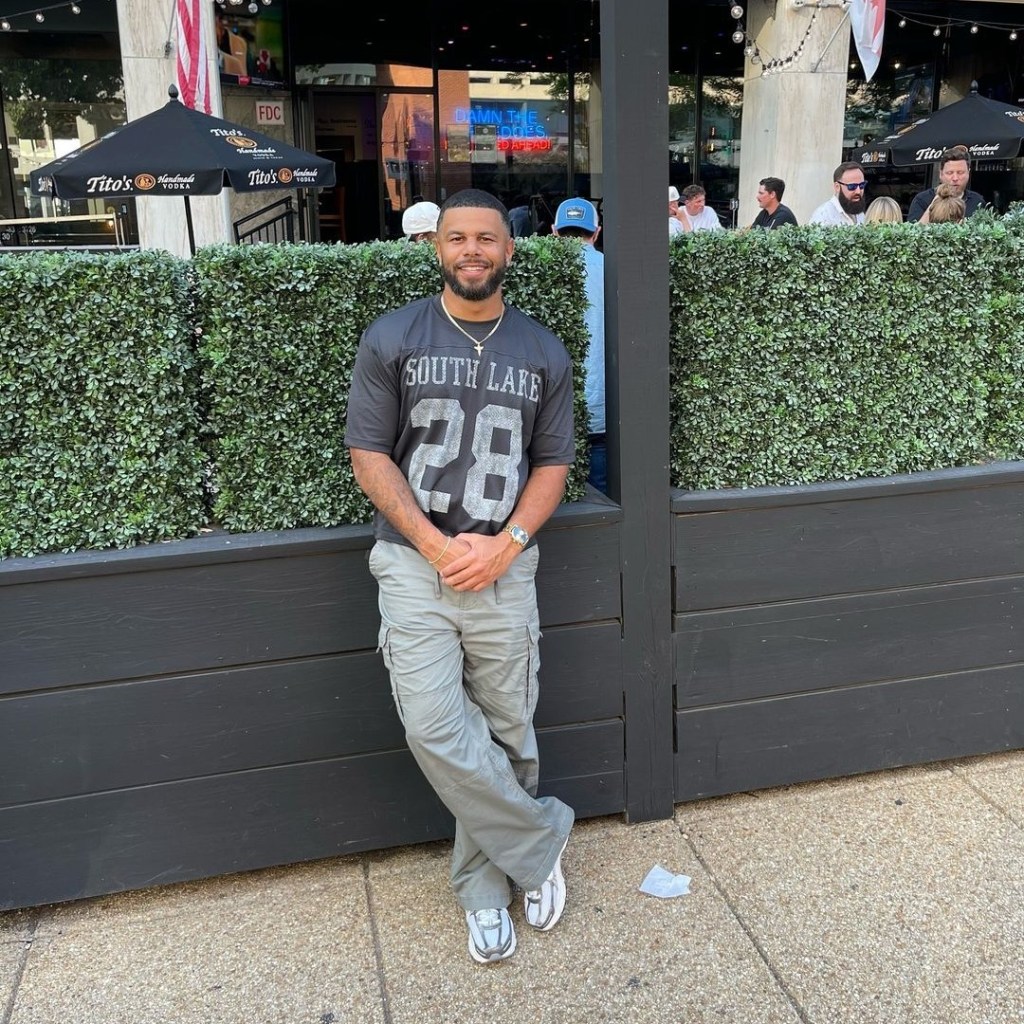 Tyler Francis posing on a sidewalk