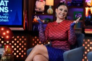 Jennifer Aydin throwing her hands in the air on WWHL.