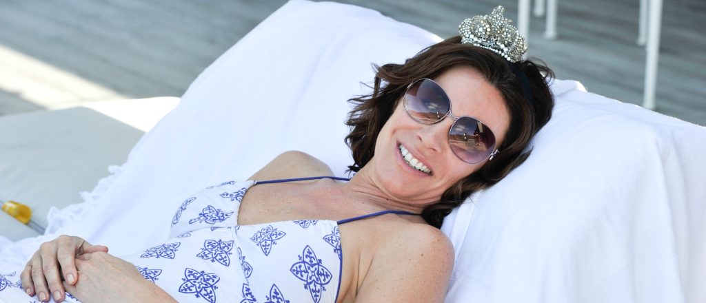 Luann de Lesseps relaxing outdoors.