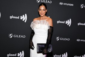 Jessel Taank in a white dress with black opera gloves.