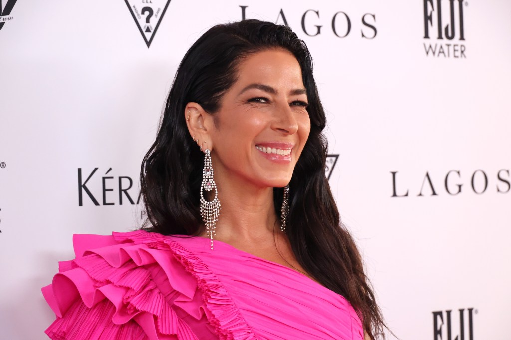 Rebecca Minkoff in a pink dress at an event.