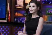 RHOC legend Heather Dubrow wearing black and sitting with her hands in her lap on WWHL.