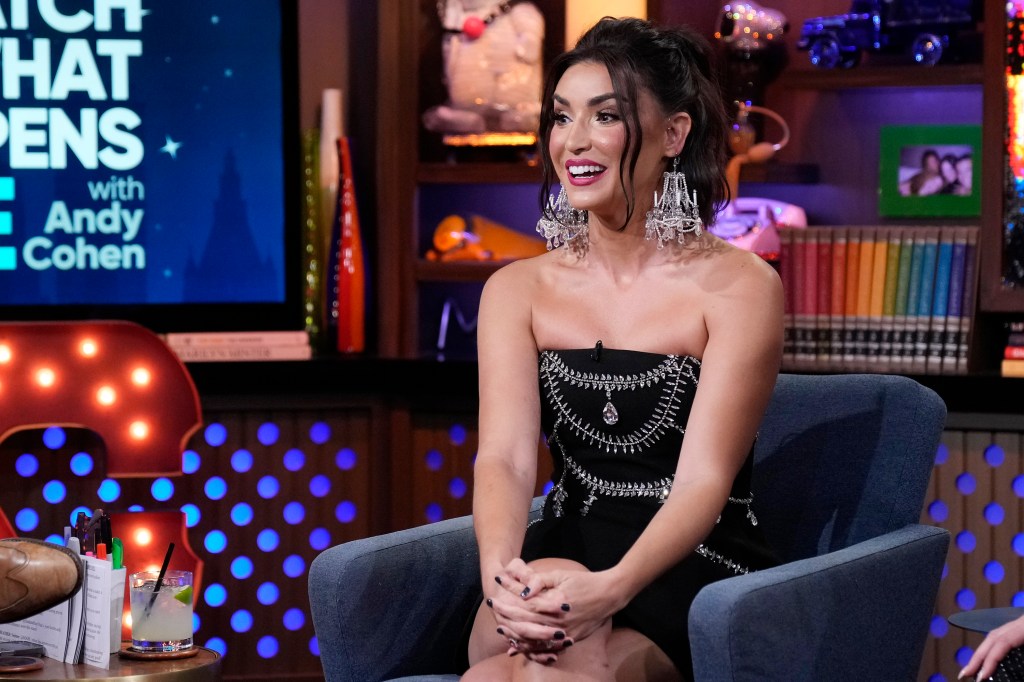 RHOSLC star Bronwyn Newport wearing chandelier earrings on WWHL.