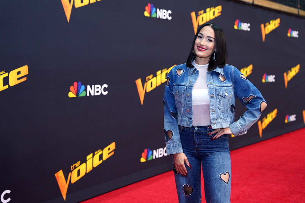 Nikki Garcia in a denim ensemble on the red carpet for The Voice. 