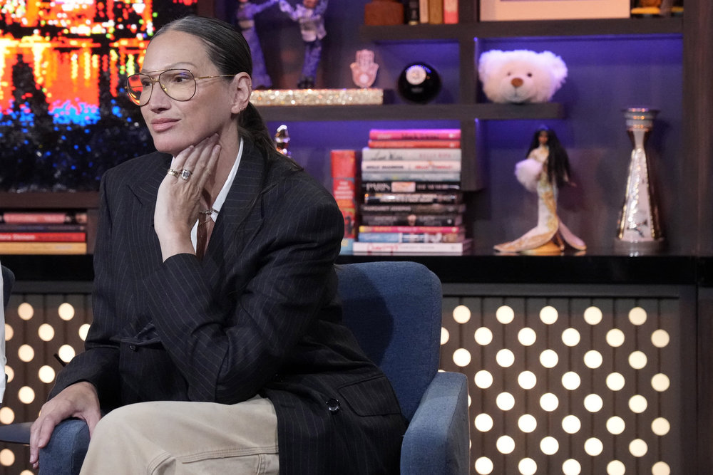 Jenna Lyons with her hand on her face on WWHL. 