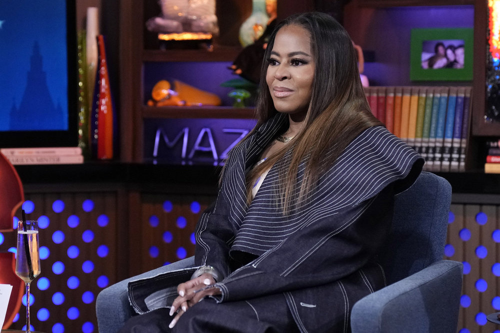 Mary Cosby with her hands in her lap looking serious on WWHL. 