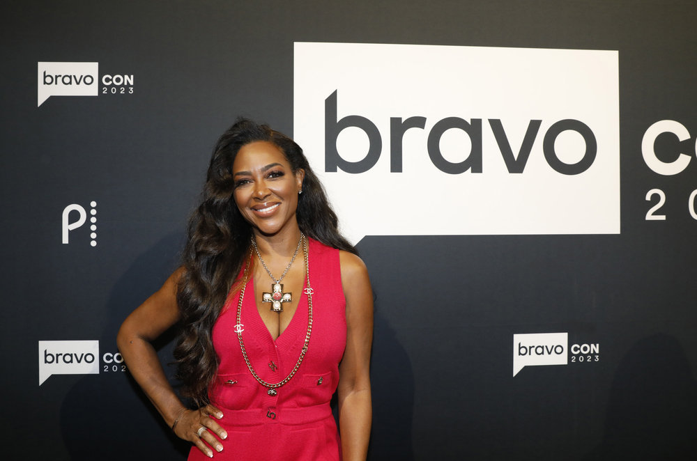 Kenya Moore in a red dress at BravoCon 2023