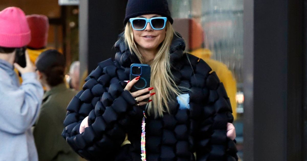 Heidi Klum Pairs All-Black Christmas Fit with Giant Fuzzy Boots