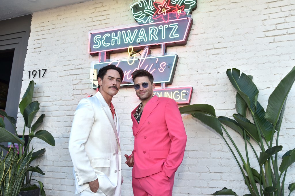 Tom Sandoval and Tom Schwartz posing in front of Schwartz & Sandy's