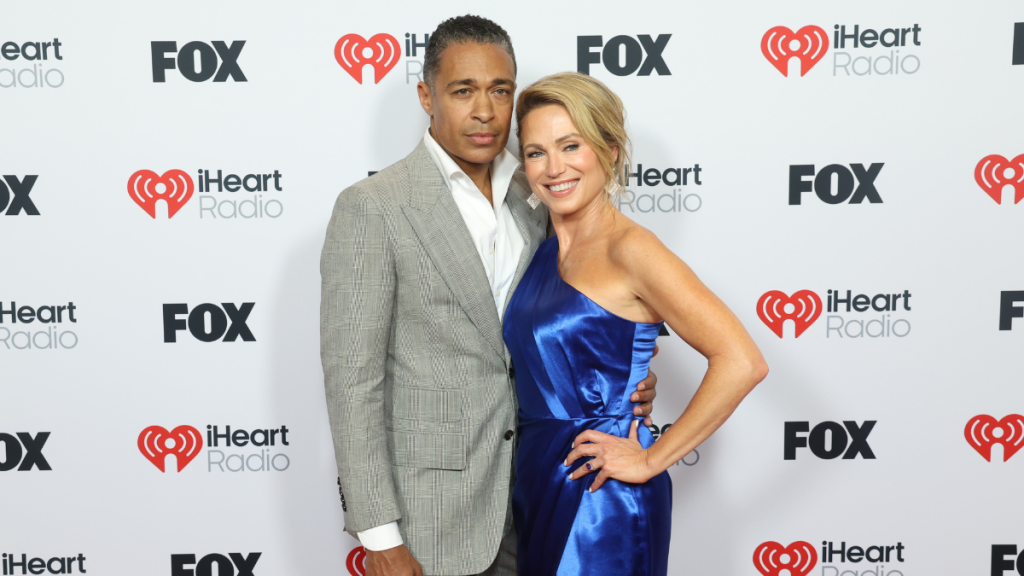 T. J. Holmes and Amy Robach attend the 2025 iHeartRadio Music Awards at Dolby Theatre in Los Angeles, California on March 17, 2025. Broadcasted live on FOX.