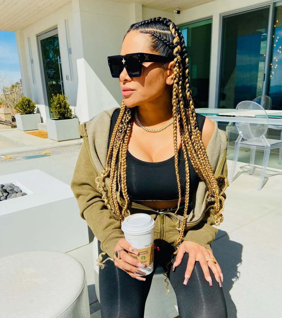 Jen Shah in box braids drinking tea